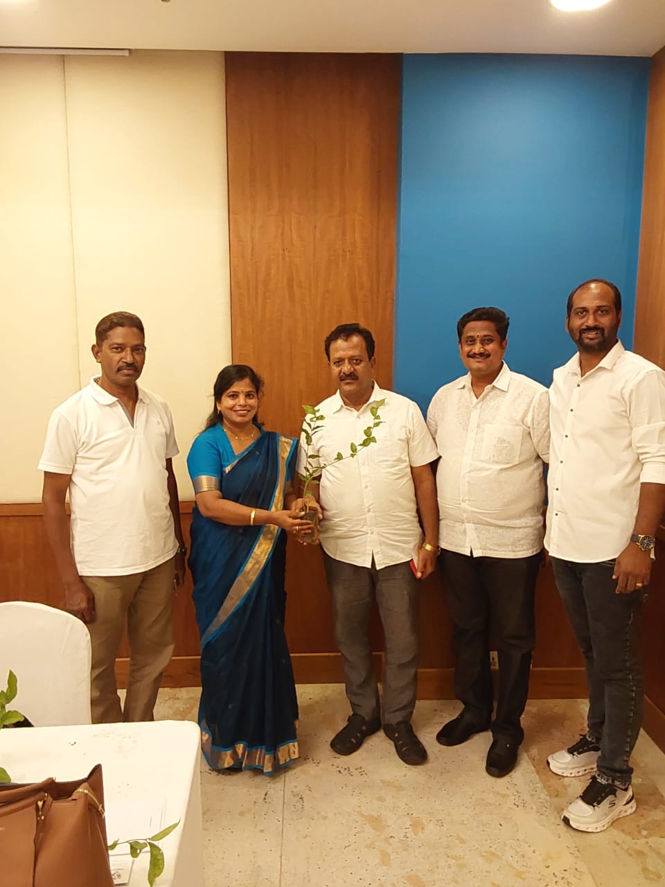 A sapling-planting exchange with fellow delegates